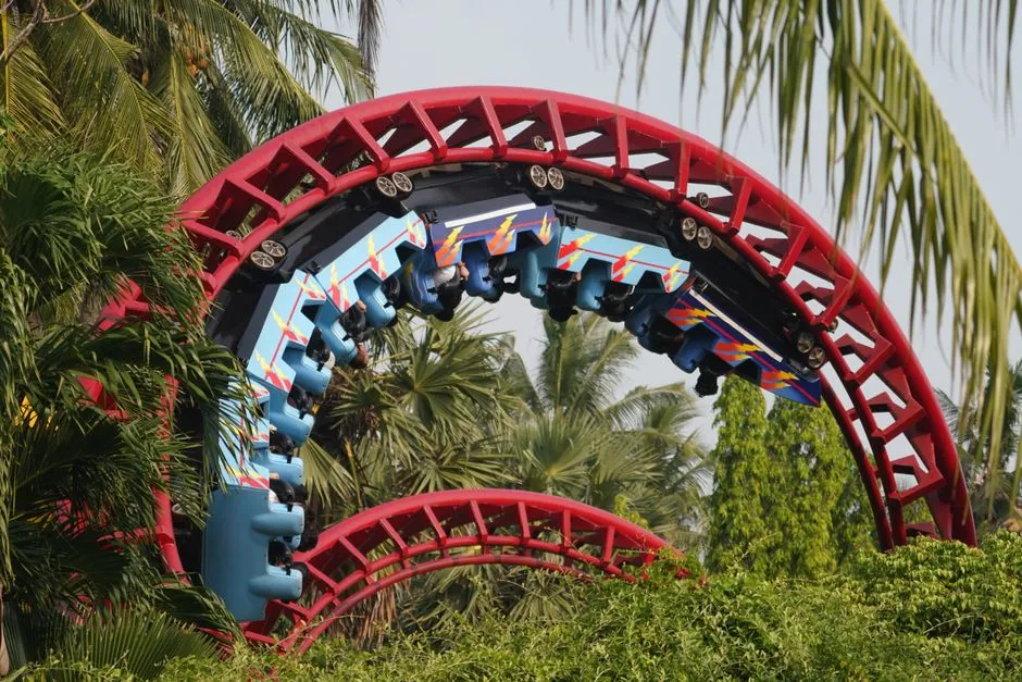 Steel roller coaster train inverted through a vertical loop